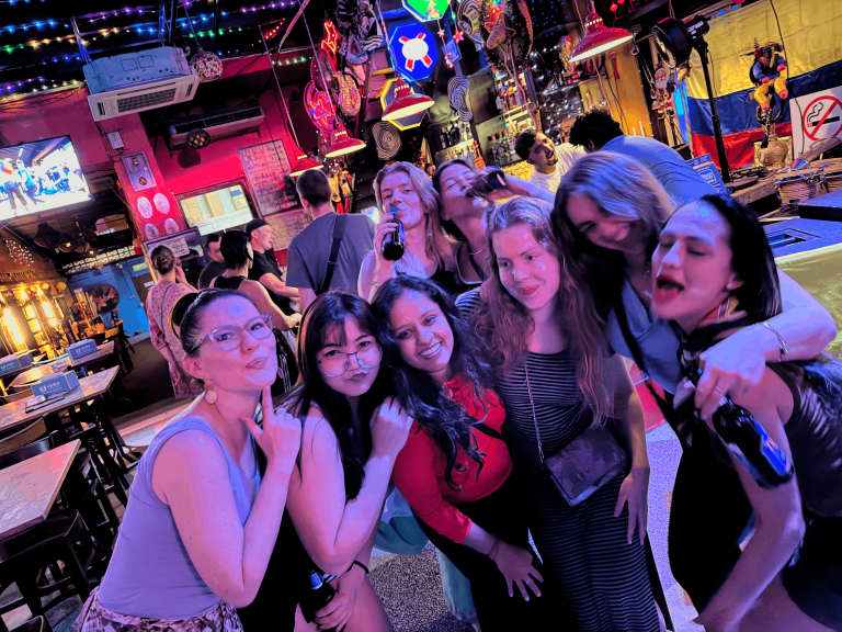A room full of Travelogue Guesthouse guests packed together in a bar