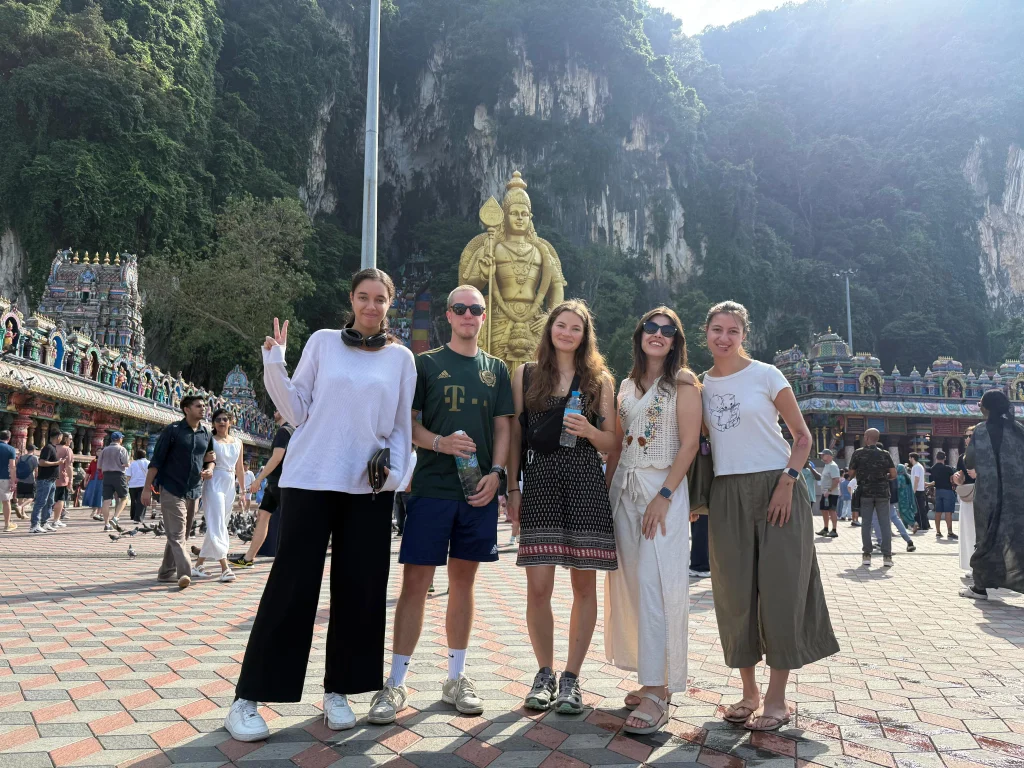 Travelogue Guesthouse guests at the Batu Caves Murugan statue, Kuala Lumpur