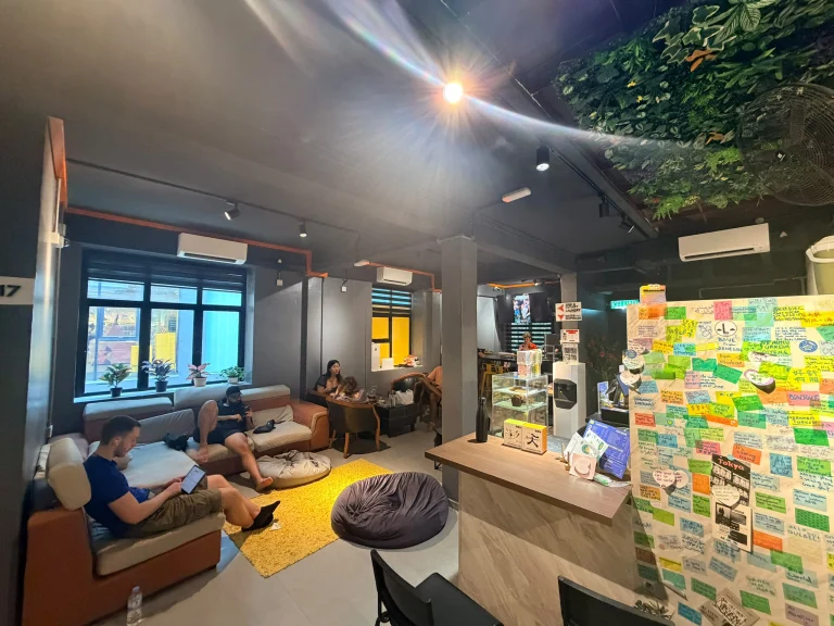 Guests together in the common area at Travelogue Guesthouse in the evening, Bukit Bintang, Kuala Lumpur