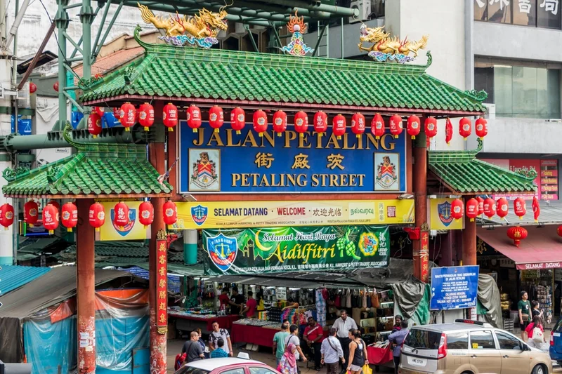The green and red gate over the entrance to Petaling Street market, Kuala Lumpur Chinatown