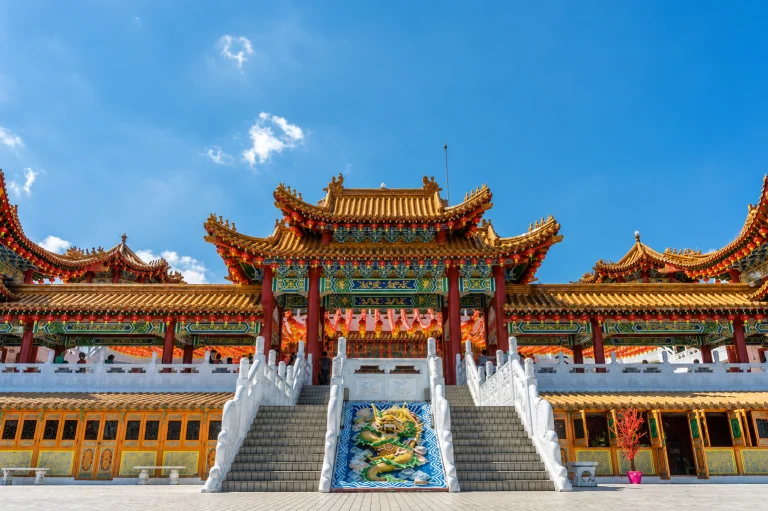 The staircase and tiered roofs of Thean Hou Temple against a clear sky