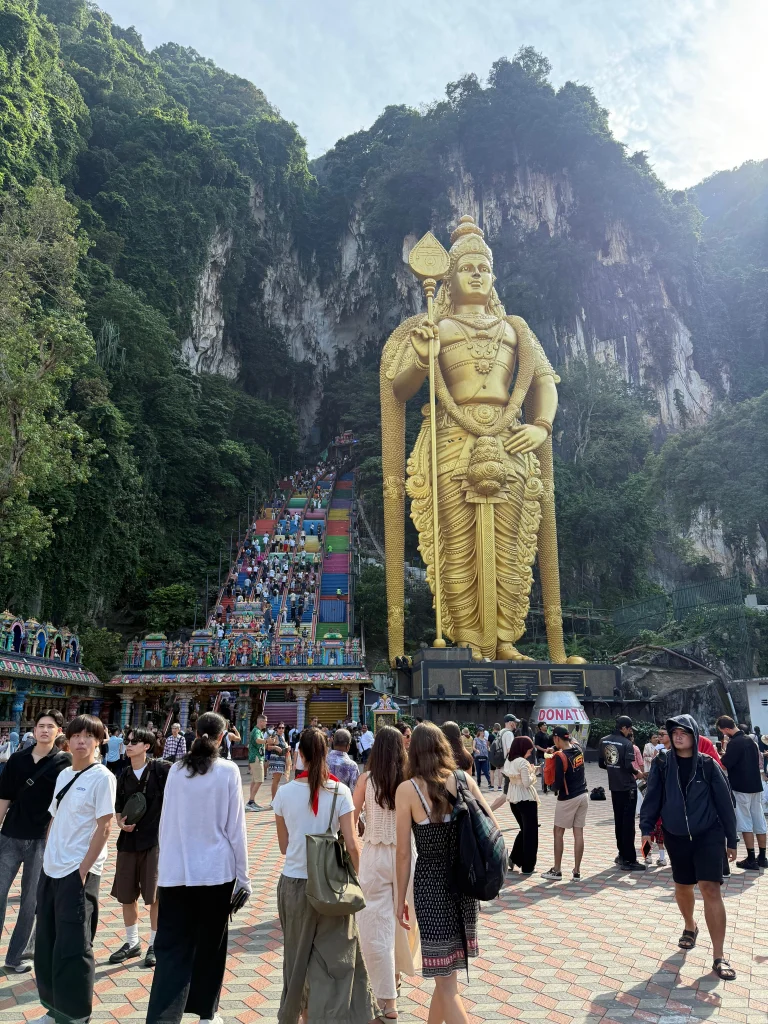 The 272 painted steps at Batu Caves climbing past the Murugan statue, Kuala Lumpur