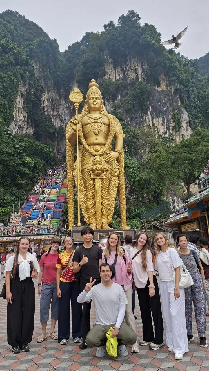 Travelogue Guesthouse guests at the foot of the Murugan statue, Batu Caves, Kuala Lumpur
