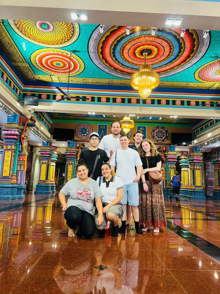 Travelogue Guesthouse guests inside a Chinese temple on the Chinatown walking tour, Kuala Lumpur