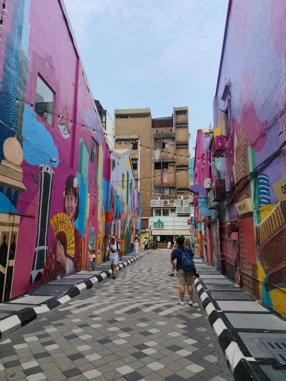 Painted shophouse walls and string lights along Graffiti Alley in Bukit Bintang, Kuala Lumpur