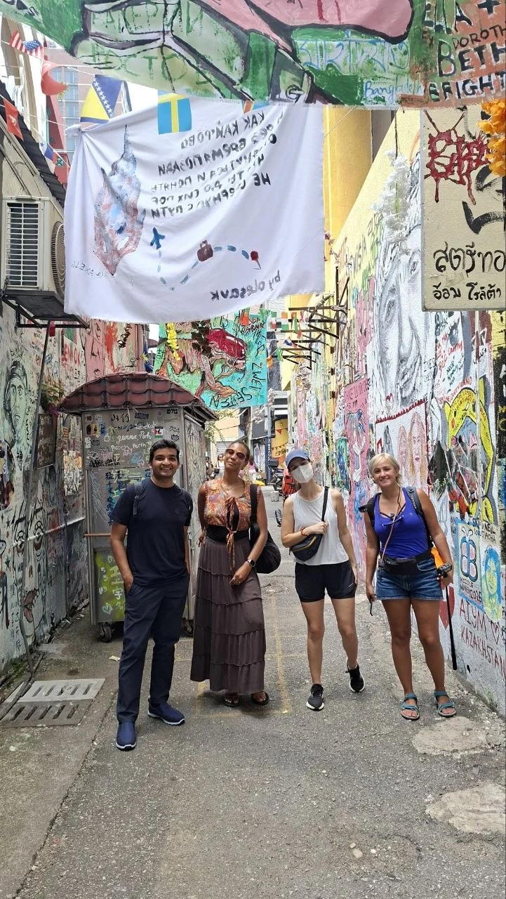 Travelogue Guesthouse guests in a graffiti-covered lane at Graffiti Alley, Bukit Bintang