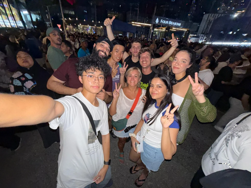 A crowd of Travelogue Guesthouse guests together on a night out in Kuala Lumpur