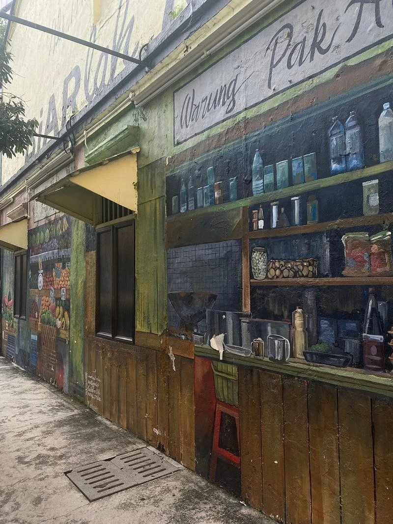 A shophouse wall painted as an old warung front in a Kuala Lumpur Chinatown back lane