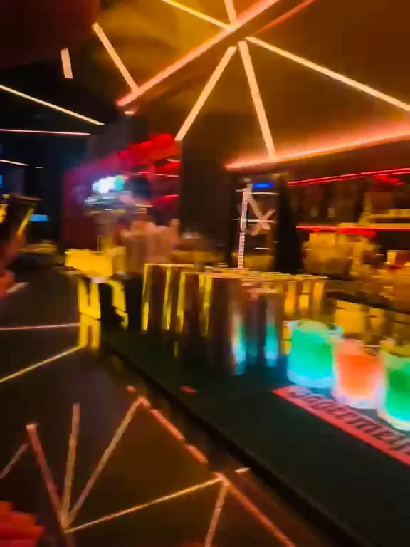Light beams across the ceiling above the bar on a Travelogue Guesthouse night out