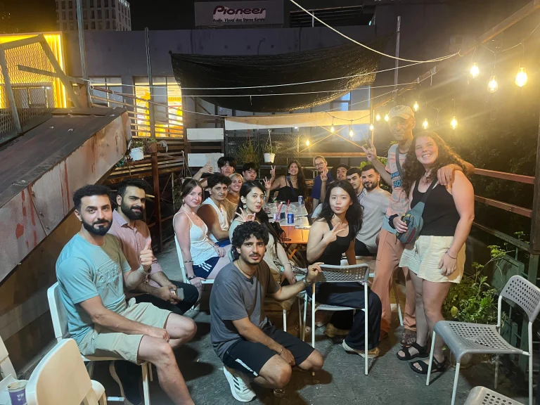 A Travelogue Guesthouse group on the rooftop at night, Kuala Lumpur