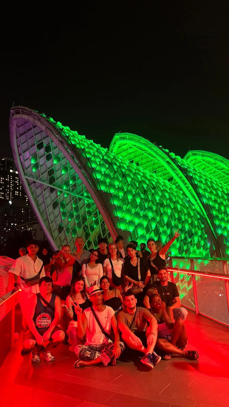 A Travelogue Guesthouse group on the lit deck of the Saloma Link bridge