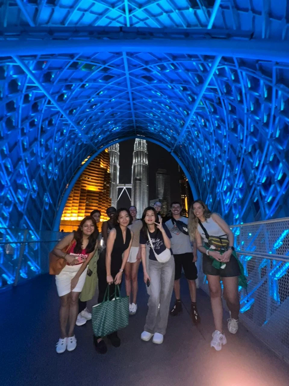 Travelogue Guesthouse guests inside the lit lattice of the Saloma Link bridge
