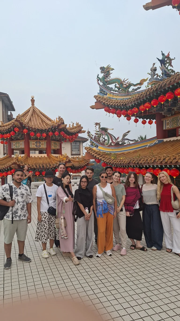 A Travelogue Guesthouse group below the roofline at Thean Hou Temple