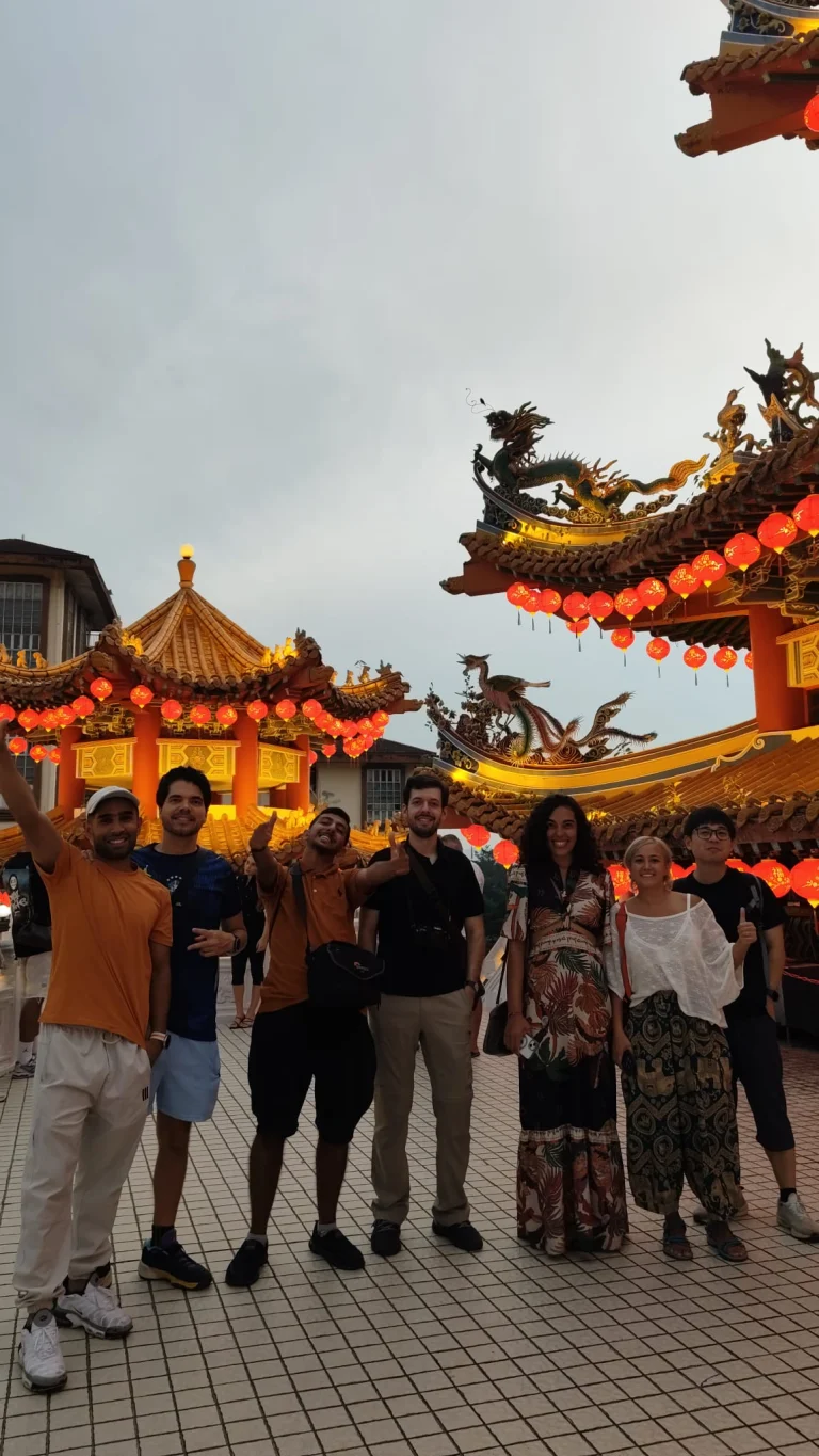 A Travelogue Guesthouse group under the lit eaves at Thean Hou Temple