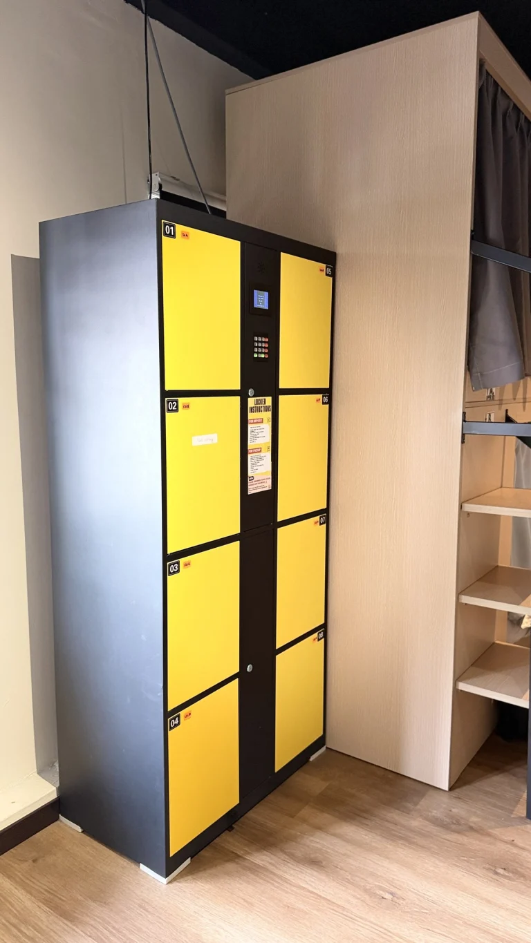 The bank of yellow lockers in the female dormitory at Travelogue Guesthouse